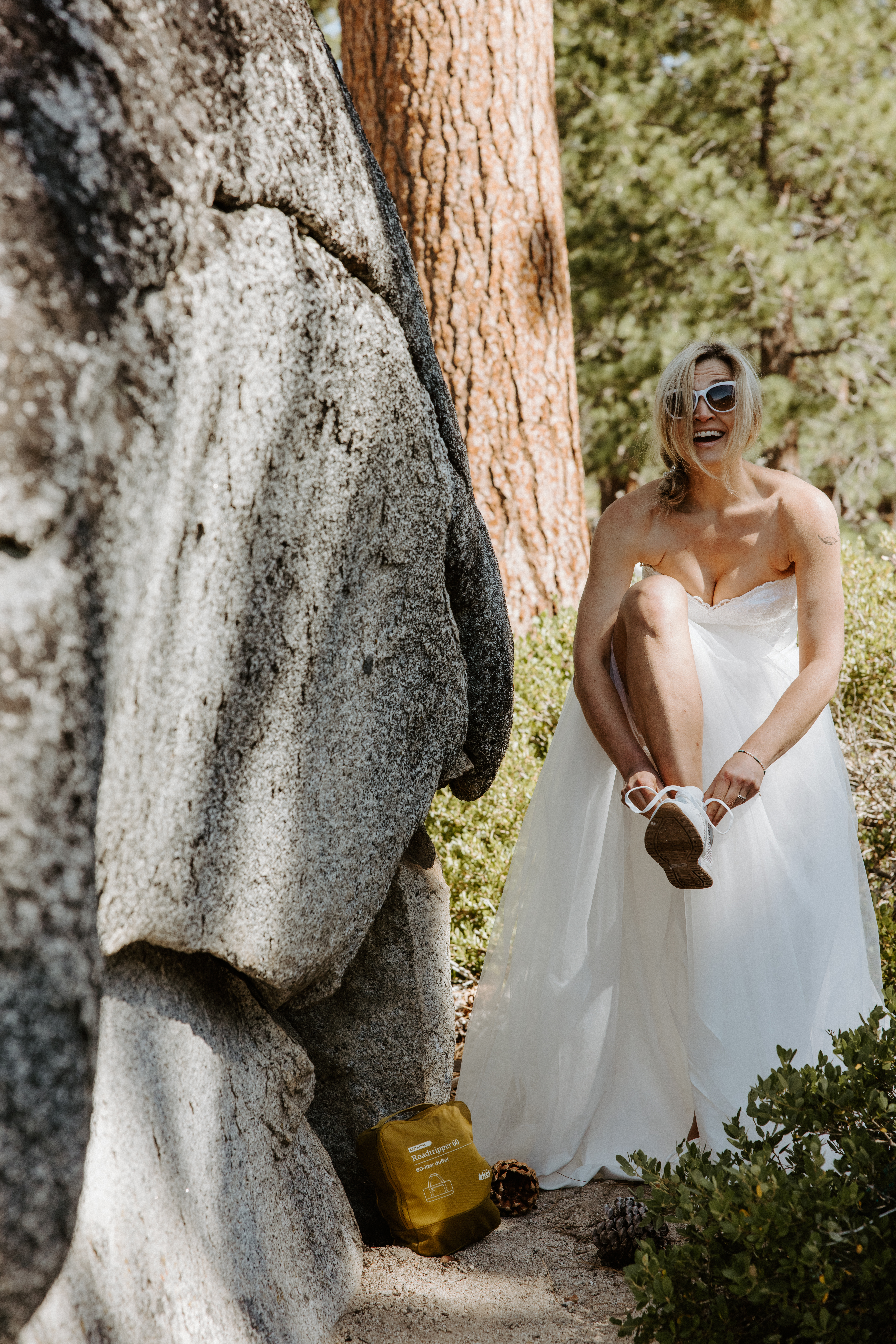 bride changing shoes on her elopement day 