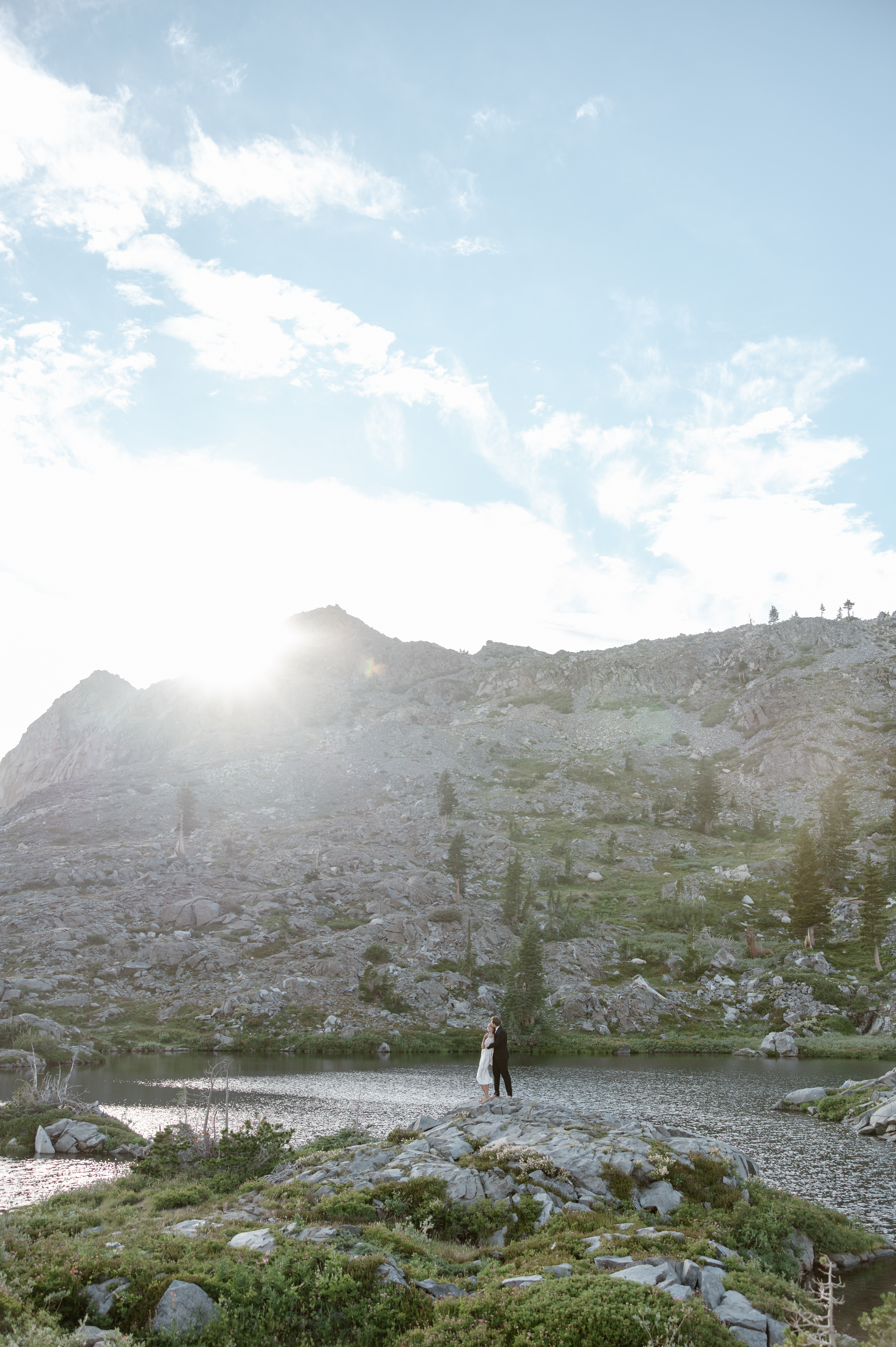Couple eloping on a remote mountain trail during an international destination elopement